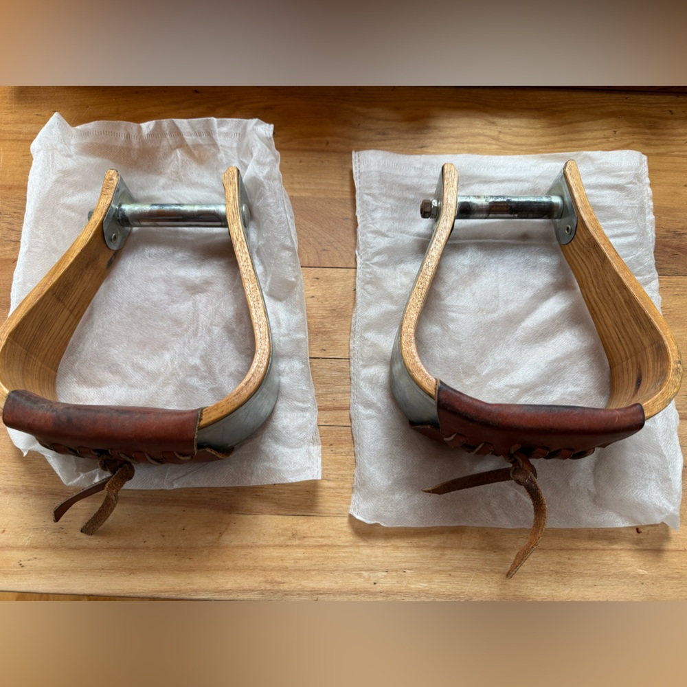 Wooden stirrups with aluminum wrapped with leather foot bed